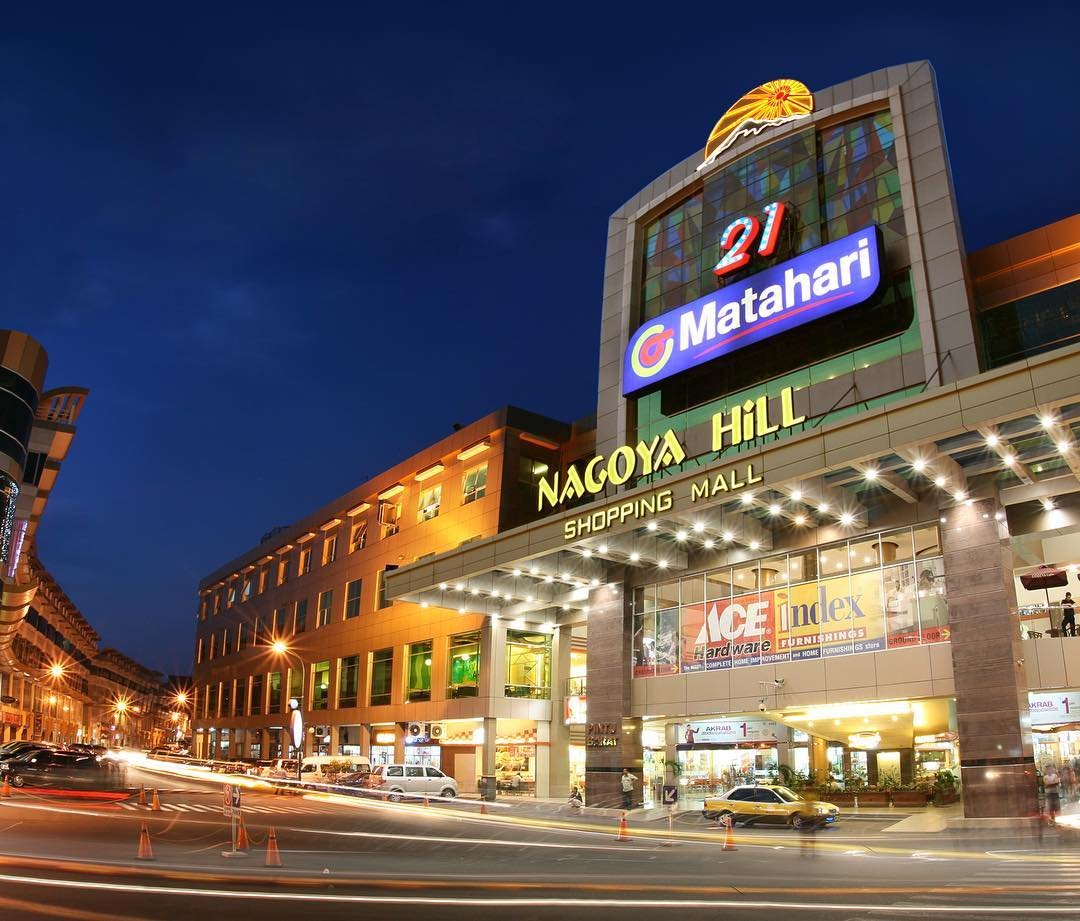 Nagoya Hill Shopping Mall exterior in Batam at night.