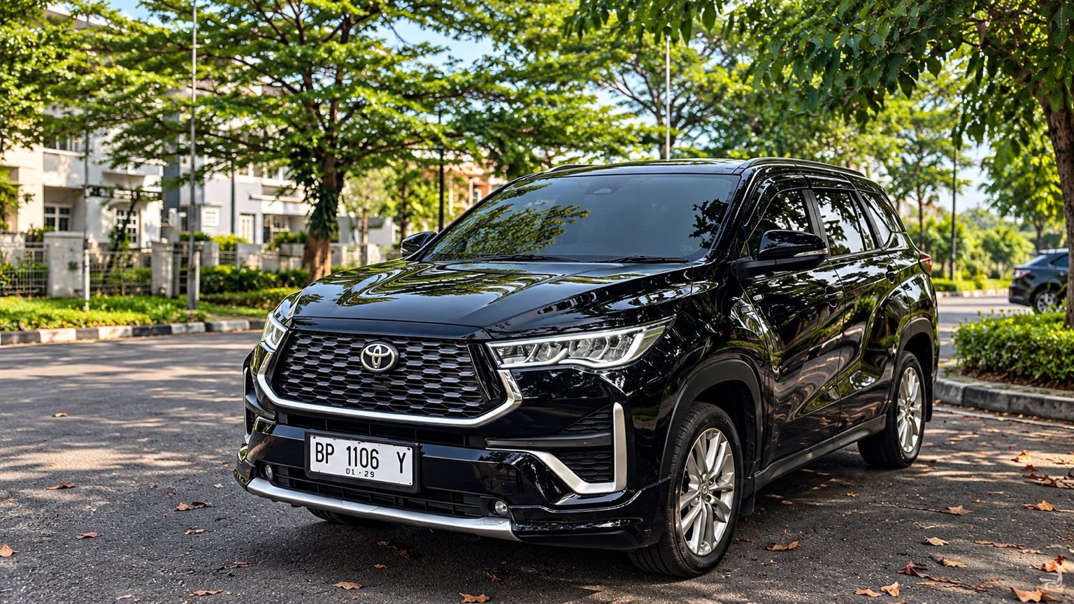 Black Toyota Innova Zenix Q in daylight, plate BP 1106 Y