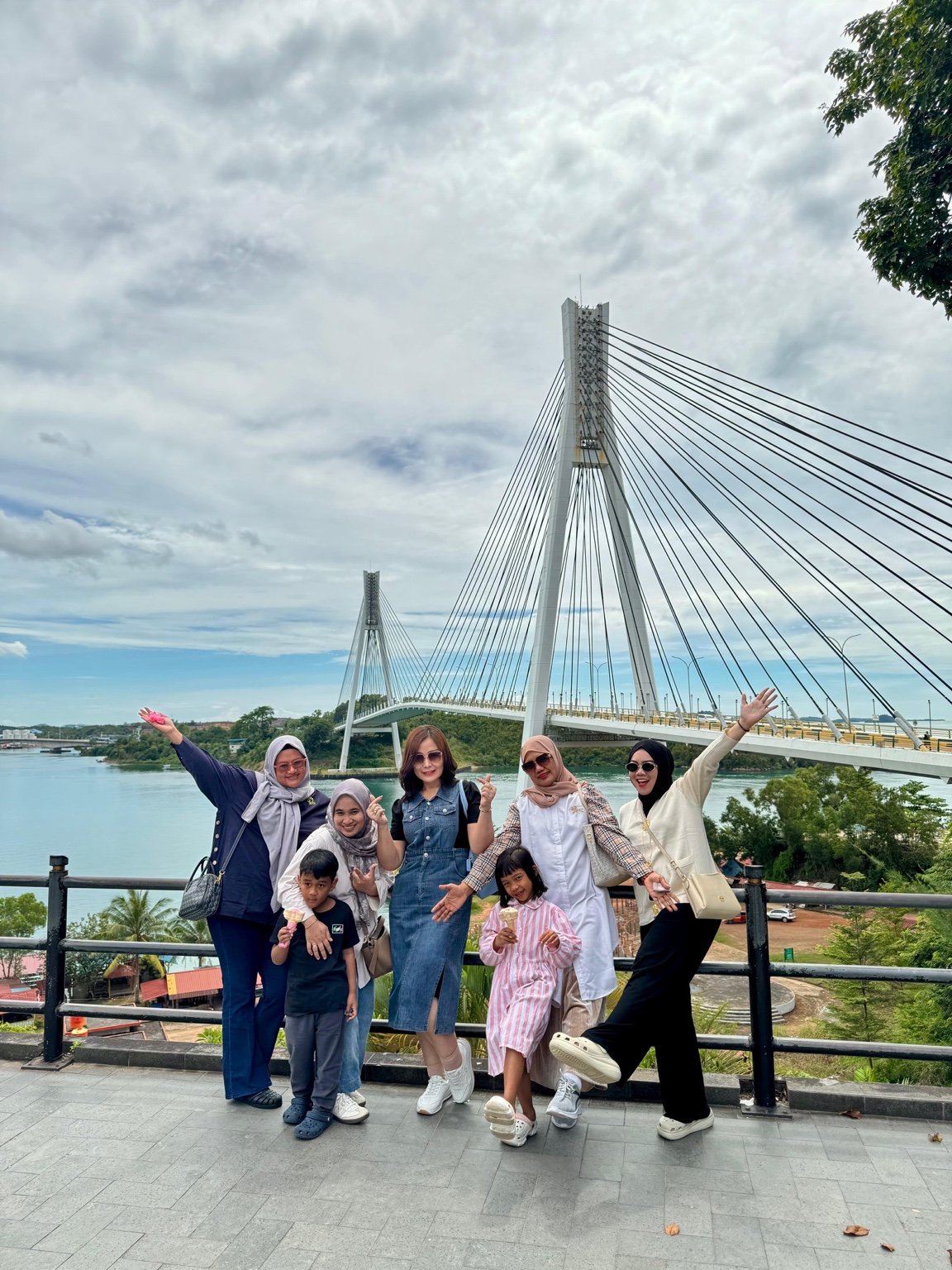 Five adults and two children at Barelang Bridge